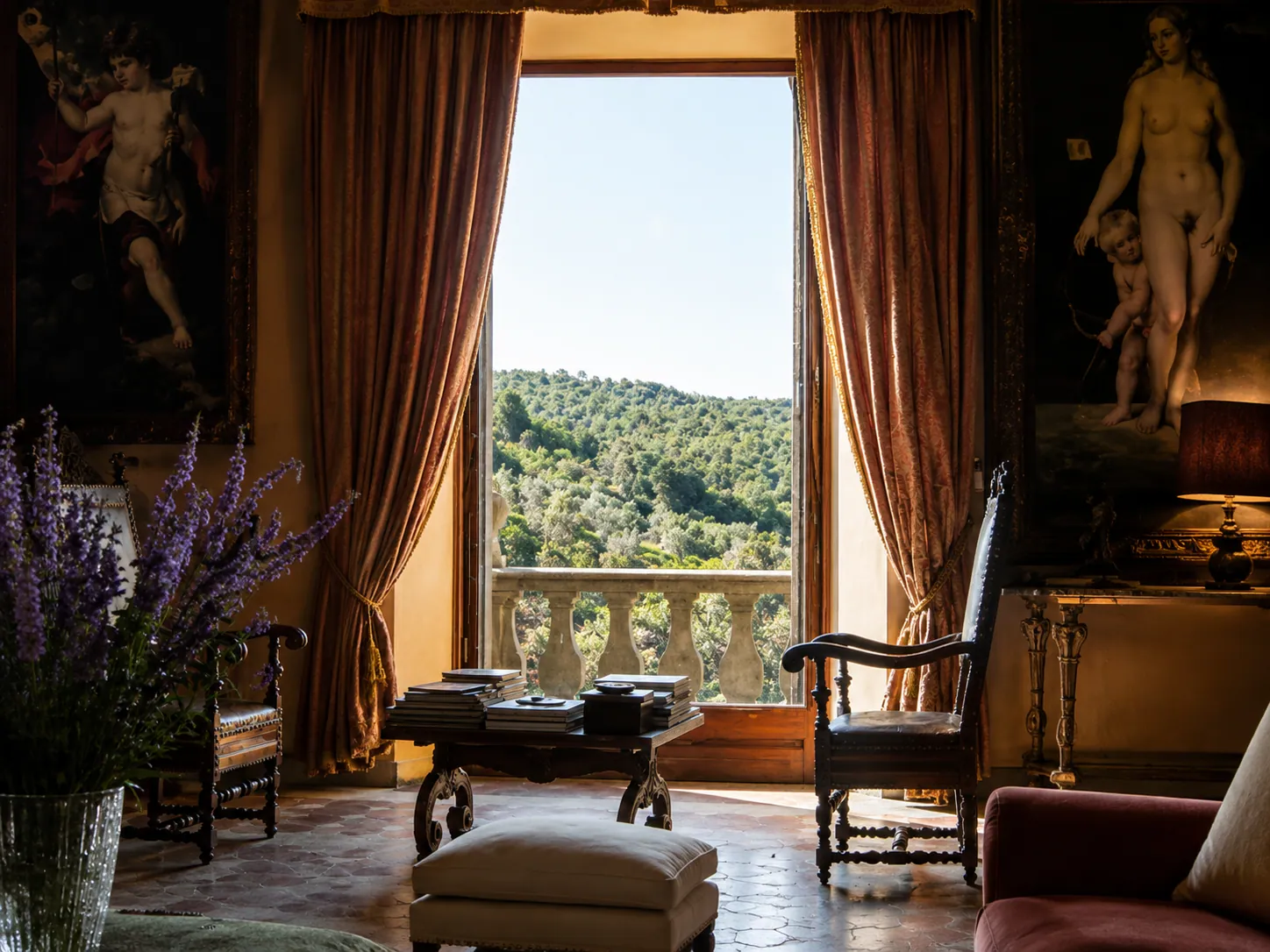 Historic castle salon framing a window view over the Umbrian hills